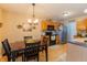 Eat-in kitchen featuring wooden cabinetry, modern appliances, and a dining area with natural light at 939 Arabian Way, Bargersville, IN 46106
