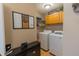 Laundry room with washer, dryer, storage cabinets and a functional design at 939 Arabian Way, Bargersville, IN 46106
