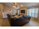 Bright living room with large windows and a comfortable sectional, creating an inviting space at 939 Arabian Way, Bargersville, IN 46106