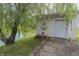 Storage shed with roll up door, next to river and decorative adornments at 939 Arabian Way, Bargersville, IN 46106