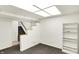 Finished basement boasting carpet flooring and a light neutral paint. The staircase is in view at 944 Briar Patch Ln, Greenwood, IN 46142