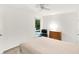 Bedroom featuring a comfortable bed, natural light from a window, and a fan at 944 Briar Patch Ln, Greenwood, IN 46142