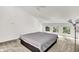 Bedroom featuring three windows and a fan at 944 Briar Patch Ln, Greenwood, IN 46142