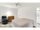 Bedroom featuring a comfortable chair, natural light from a window, and a fan at 944 Briar Patch Ln, Greenwood, IN 46142