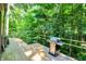 Outdoor deck with a grill and view of lush greenery, perfect for outdoor cooking and entertaining at 944 Briar Patch Ln, Greenwood, IN 46142