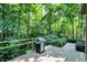Outdoor deck with a grill and lush greenery, perfect for outdoor cooking and entertaining at 944 Briar Patch Ln, Greenwood, IN 46142