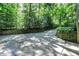 Long driveway framed by retaining walls and mature trees at 944 Briar Patch Ln, Greenwood, IN 46142