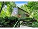 Charming exterior view with stairs and greenery surrounding the home, offering a peaceful retreat at 944 Briar Patch Ln, Greenwood, IN 46142