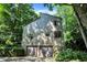 Unique two-story home featuring an attached two-car garage and surrounded by mature trees at 944 Briar Patch Ln, Greenwood, IN 46142