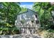 Unique two-story home featuring an attached two-car garage and surrounded by mature trees at 944 Briar Patch Ln, Greenwood, IN 46142