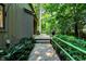 Inviting exterior pathway with a wooden walkway and lush greenery, leading to the home at 944 Briar Patch Ln, Greenwood, IN 46142