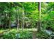 Well-maintained home nestled in lush foliage and mature trees at 944 Briar Patch Ln, Greenwood, IN 46142