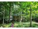 Well-maintained home surrounded by lush foliage and mature trees at 944 Briar Patch Ln, Greenwood, IN 46142