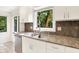 Kitchen featuring granite countertops, stainless steel appliances, white cabinets and large window at 944 Briar Patch Ln, Greenwood, IN 46142