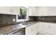 Kitchen featuring granite countertops, stainless steel appliances, white cabinets and tile floors at 944 Briar Patch Ln, Greenwood, IN 46142