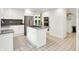 Kitchen features white cabinetry, granite countertops, stainless steel appliances, and tile flooring at 944 Briar Patch Ln, Greenwood, IN 46142