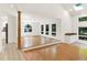 Spacious living room featuring hardwood floors and a wet bar, perfect for entertaining guests at 944 Briar Patch Ln, Greenwood, IN 46142