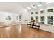 Bright living room with skylights, hardwood floors, and large windows providing ample natural light and views at 944 Briar Patch Ln, Greenwood, IN 46142