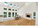 Bright living room with hardwood floors, skylights and a fireplace, offering a cozy and inviting atmosphere at 944 Briar Patch Ln, Greenwood, IN 46142