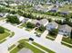 Community aerial shot with various architectural styles, tree-lined streets, and manicured lawns at 951 Curlew Ln, Greenwood, IN 46143