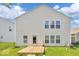 The backyard features a small wooden deck and a grassy lawn at 951 Curlew Ln, Greenwood, IN 46143