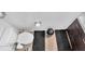 Clean bathroom features a toilet, vanity, and neutral decor at 951 Curlew Ln, Greenwood, IN 46143