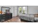 Bright bedroom with a large window, modern dresser, and natural light at 951 Curlew Ln, Greenwood, IN 46143