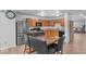 Kitchen with stainless steel appliances, wood cabinets and adjacent dining area at 951 Curlew Ln, Greenwood, IN 46143