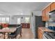 Open kitchen boasts stainless steel appliances, granite countertops, and an adjacent dining area at 951 Curlew Ln, Greenwood, IN 46143