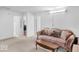 Open-concept living room featuring neutral walls, carpeting, and a sofa at 951 Curlew Ln, Greenwood, IN 46143