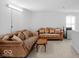 Spacious living room with carpeting and two comfortable sofas with pillows at 951 Curlew Ln, Greenwood, IN 46143