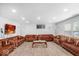 This room showcases wood floors, recessed lighting, and four sofas at 951 Curlew Ln, Greenwood, IN 46143