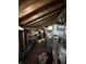 Attic space with exposed beams, offering ample storage and organization solutions at 9550 N Delaware St, Indianapolis, IN 46240