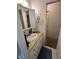 Functional bathroom showcasing a vanity with a sink, a mirror, and basic storage at 9550 N Delaware St, Indianapolis, IN 46240