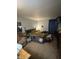 Bedroom featuring a king bed with a warm, inviting blanket and a cozy recliner at 9550 N Delaware St, Indianapolis, IN 46240