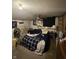 Bedroom with fan, window, carpeted floor, dresser and closet for organization at 9550 N Delaware St, Indianapolis, IN 46240