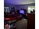 A dimly lit bedroom with a bed, TV, and several boxes at 9550 N Delaware St, Indianapolis, IN 46240