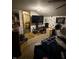 This is a poorly maintained bedroom with a TV and miscellaneous items at 9550 N Delaware St, Indianapolis, IN 46240
