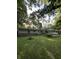 A charming home with a well-maintained lawn surrounded by mature trees at 9550 N Delaware St, Indianapolis, IN 46240