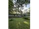 A charming home with a well-maintained lawn surrounded by mature trees at 9550 N Delaware St, Indianapolis, IN 46240