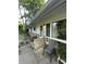 Side view of the house with an exterior air conditioning unit and small patio area at 9550 N Delaware St, Indianapolis, IN 46240