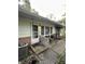 A front entrance with white door and small covered concrete porch at 9550 N Delaware St, Indianapolis, IN 46240