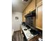 Cozy kitchen with wooden cabinets, essential appliances, and practical cooking space at 9550 N Delaware St, Indianapolis, IN 46240