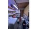 Laundry room with a washer, storage shelves and a utility sink, for convenience at 9550 N Delaware St, Indianapolis, IN 46240