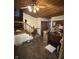 Open concept living space with wooden ceiling, staircase and an open floor plan at 9550 N Delaware St, Indianapolis, IN 46240