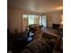Open living room with hardwood floors, comfortable sofas, and bright natural light at 9550 N Delaware St, Indianapolis, IN 46240