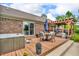 A back deck with a hot tub, dining table, and outdoor cooking area at 10174 N County Road 471 E, Pittsboro, IN 46167