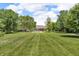 Expansive backyard features an in-ground pool and lush greenery at 10174 N County Road 471 E, Pittsboro, IN 46167