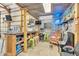 Recreational room showcases a bar area with neon lighting, a popcorn maker, and arcade games at 10174 N County Road 471 E, Pittsboro, IN 46167