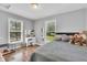 Bright bedroom with two large windows, light grey walls, and a comfortable bed at 10174 N County Road 471 E, Pittsboro, IN 46167